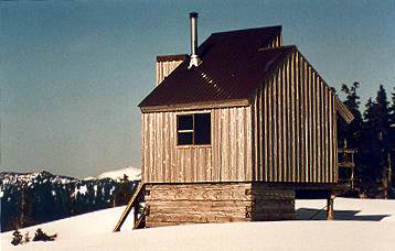 Mountain-top cabin in snow season.